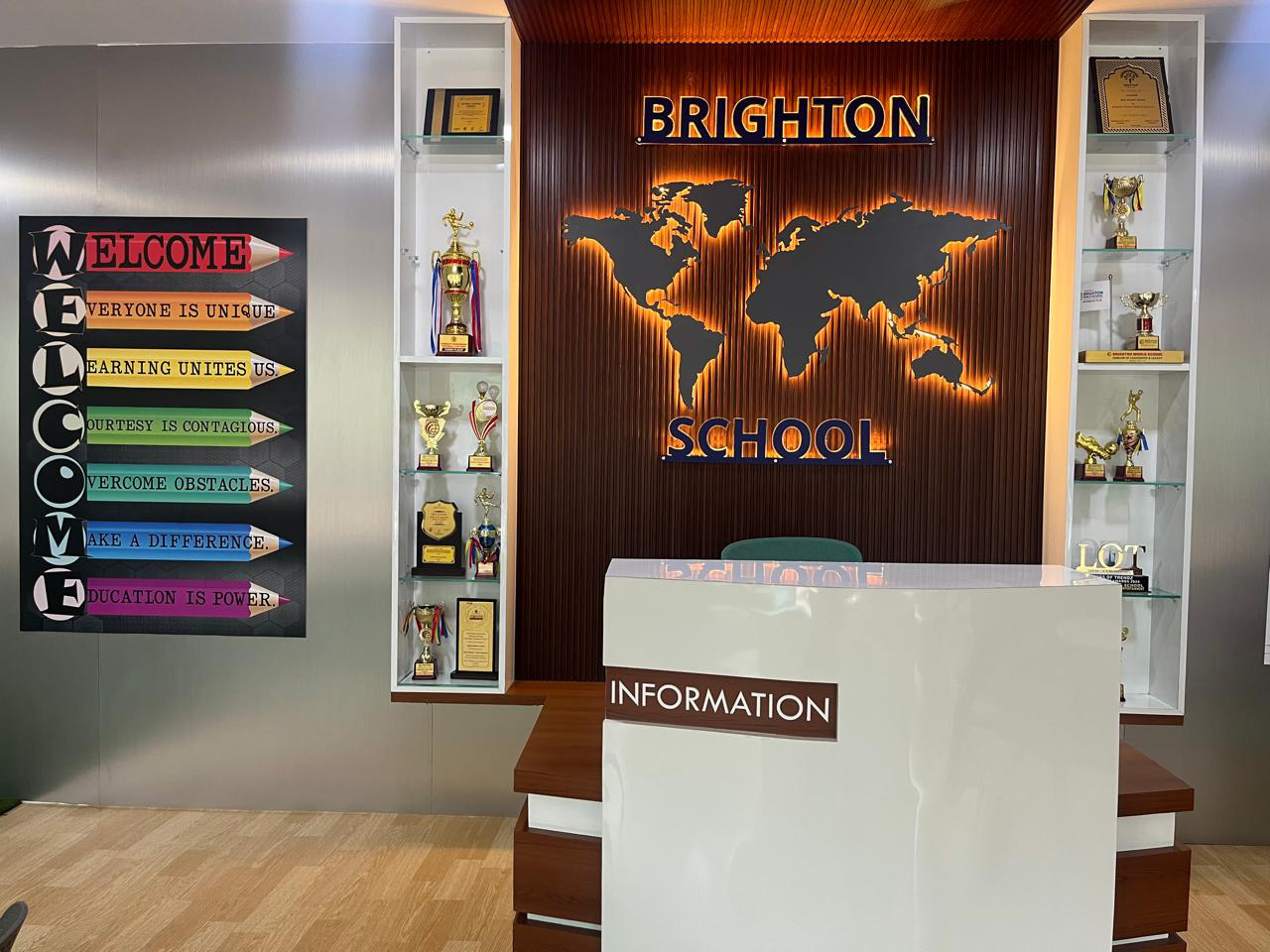 Brighton World School modern reception area with wood paneling and world map