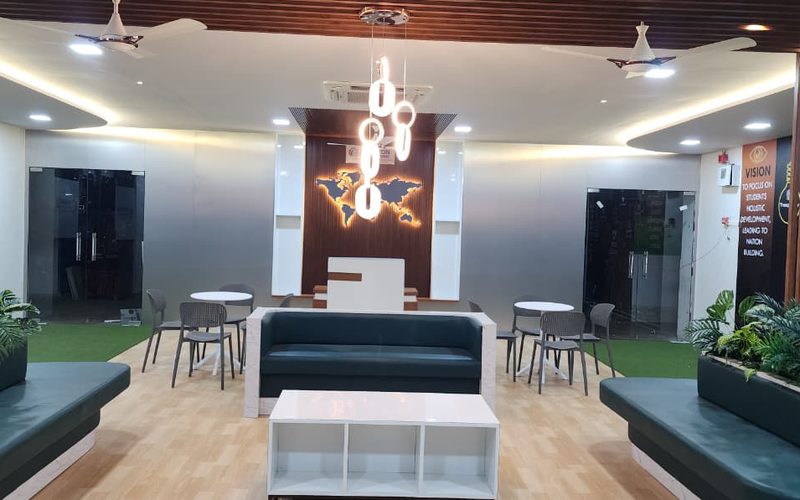 Brighton World School reception area with modern decor and world map wall feature